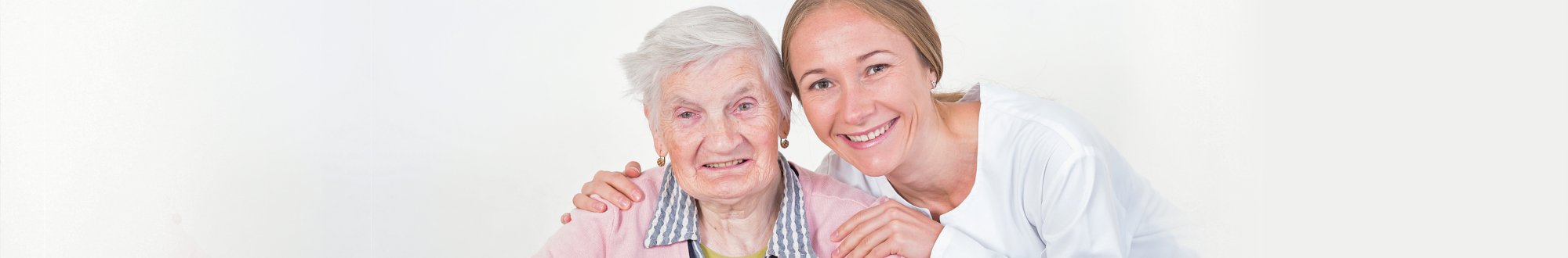 a portrait of a woman and senior woman smiling